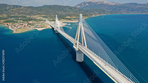 Aerial drone photo of world famous cable suspension bridge of Rio - Antirio Harilaos Trikoupis, crossing Corinthian Gulf, mainland Greece to Peloponnese, Patras photo