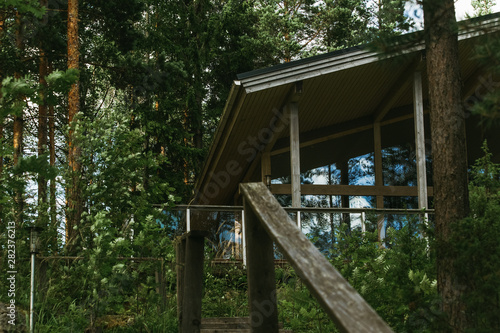 Fototapeta Naklejka Na Ścianę i Meble -  Scandinavian style house in the Northern green forest
