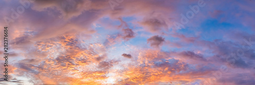 Fototapeta Naklejka Na Ścianę i Meble -  Dramatic vibrant color with beautiful cloud of sunrise and sunset on a cloudy day. Panoramic image.