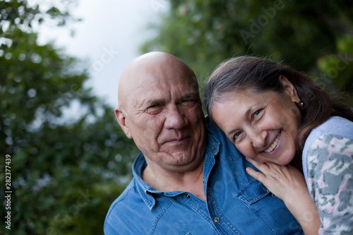 Mature couple in summer country garden