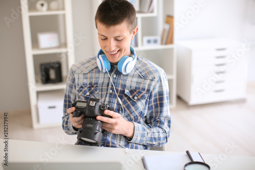 Teenage boy with photo came...