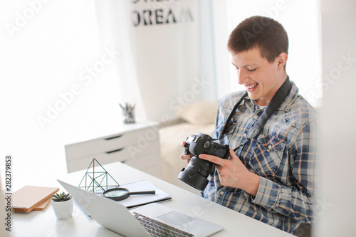 Teenage boy with photo came...