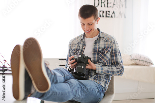Teenage boy with photo came...