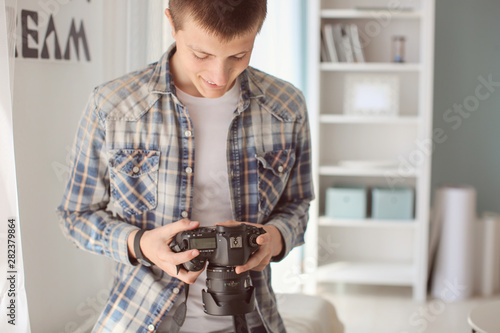 Teenage boy with photo came...