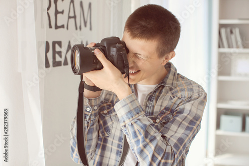 Teenage boy with photo came...