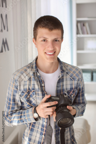 Teenage boy with photo came...
