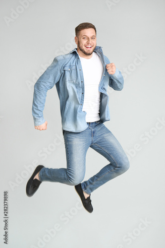 Handsome jumping young man ...