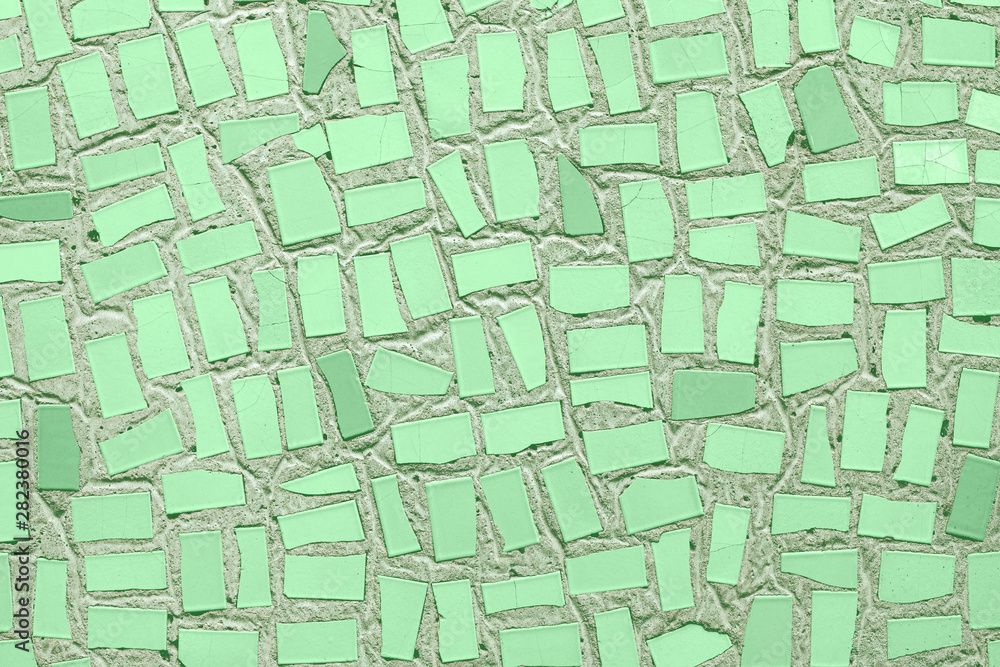 Fototapeta premium Closeup of trendy neo mint coloured abstract mosaic ceramic tiles patterned background. Year color concept.