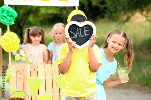 Cute little children sellin...