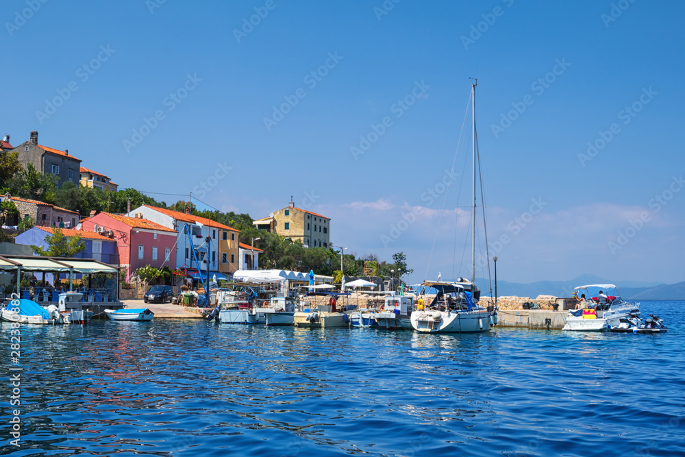 village Valun with harbor and boats, Cres island, Croatia.