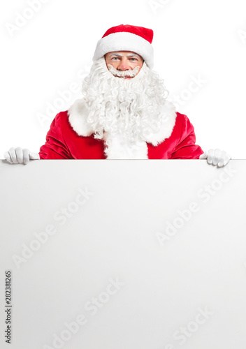 Portrait of Santa Claus with blank poster on white background
