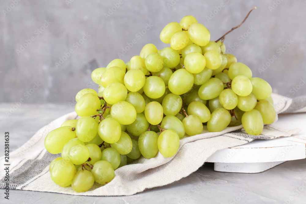 Tasty fresh grapes on grunge background Tasty fresh grapes on grunge background