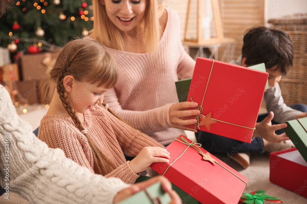 Happy family with Christmas gifts at home Happy family with Christmas gifts at home