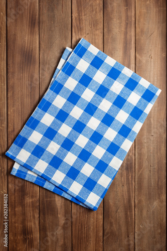 cloth napkin on at rustic wooden plank