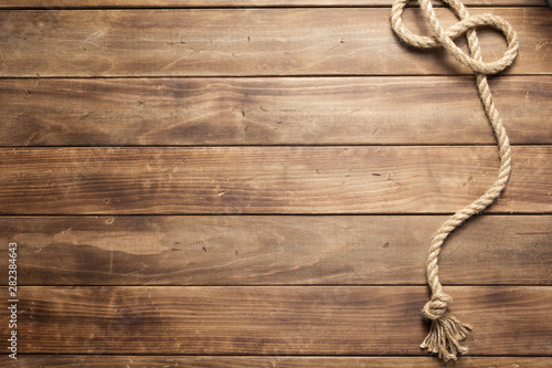 Fototapeta Naklejka Na Ścianę i Meble -  ship rope at wooden board background