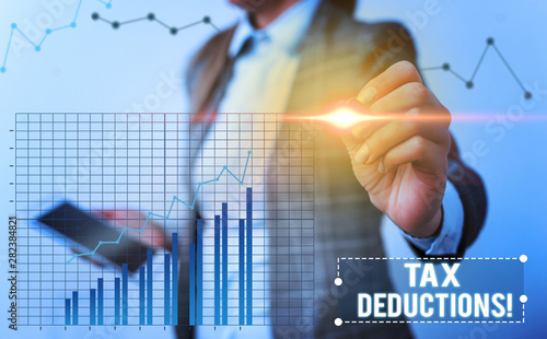 Conceptual hand writing showing Tax Deductions. Concept meaning reduction income that is able to be taxed of expenses
