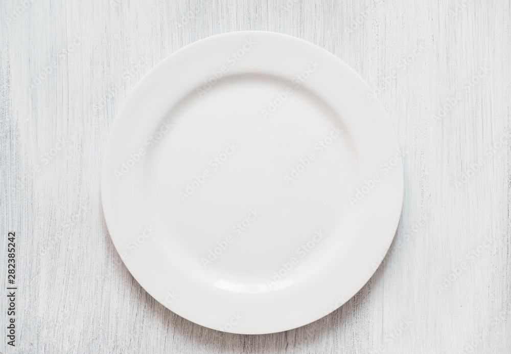 White round plate on white background. Empty white plate on white background. White round plate on white background. Empty white plate on white background.