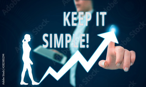 Text sign showing Keep It Simple. Business photo text ask something easy understand not go into too much detail Female human wear formal work suit presenting presentation use smart device