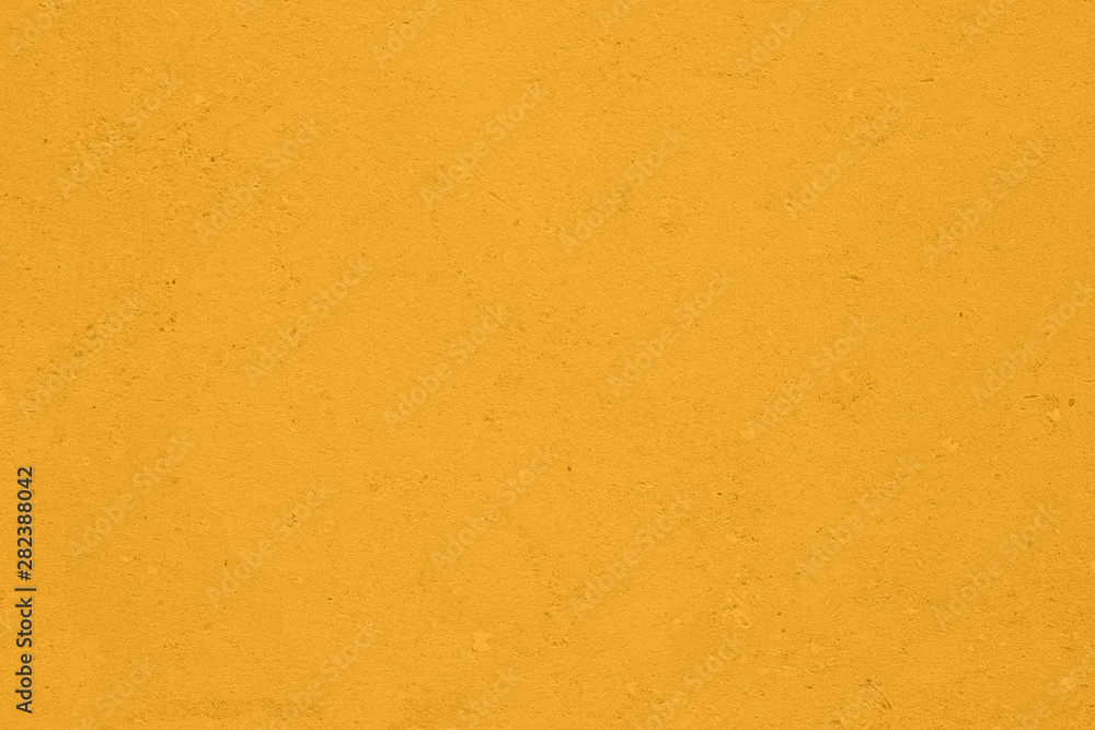 Saturated mellow yellow colored low contrast Concrete textured background with roughness and irregularities to your concept or product. Saturated mellow yellow colored low contrast Concrete textured background with roughness and irregularities to your concept or product.