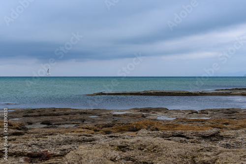 Black Sea coast on a cloudy day with clouds in the sky.