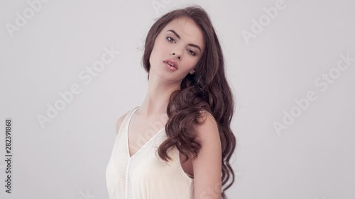 Wallpaper Mural Girl turns around and looks into the camera. Beautiful woman with long brown hair. Torontodigital.ca