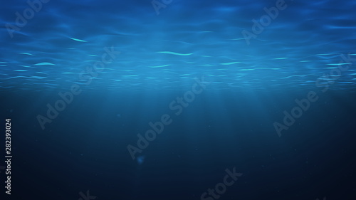 Rays of sunlight shining from above penetrate deep clear blue water. Sun light beams underwater. Small bubbles move up, under the water surface. 3D Rendering