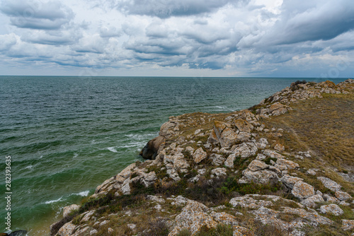 Tableau sur toile The beaches of the generals of the Crimean peninsula in cloudy weather, with birds on the shore, shot during the season of golden autumn yellow-golden brown color