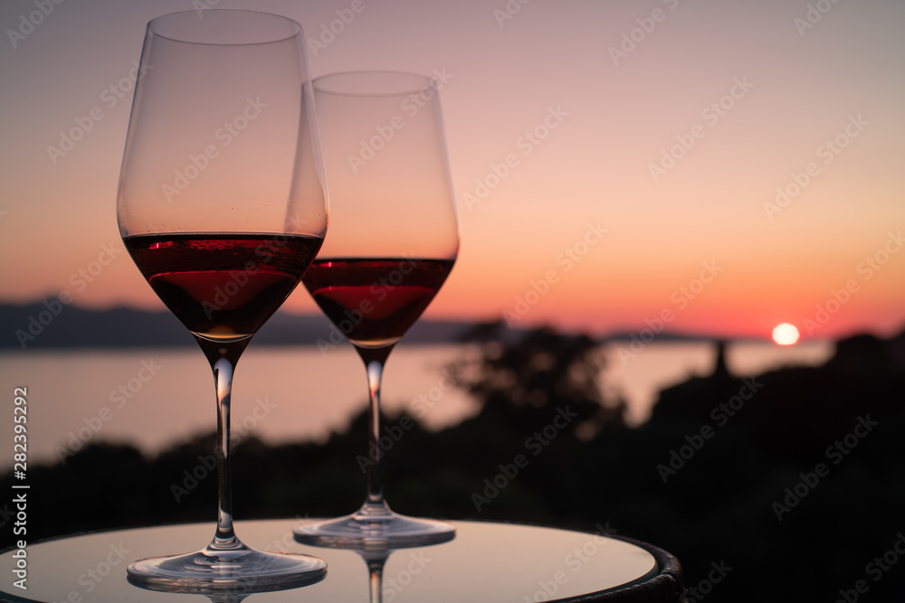 Enjoying a drink and a romantic sunset