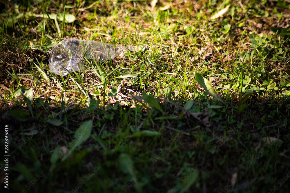 Obraz premium Crumpled plastic wrap in the grass