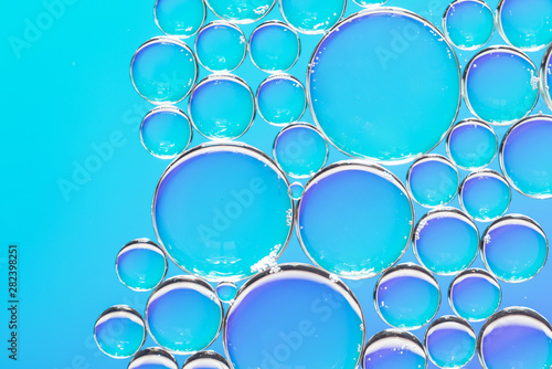 Clear air bubbles on azure background