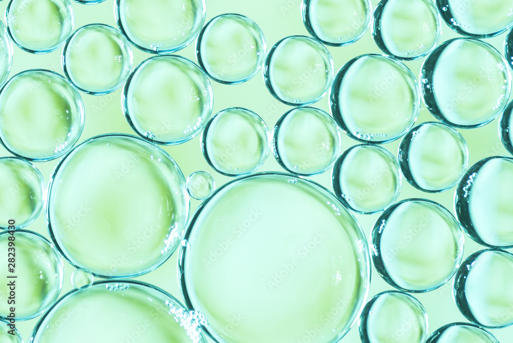 Transparent air bubbles in liquid on multicolored background Transparent air bubbles in liquid on multicolored background
