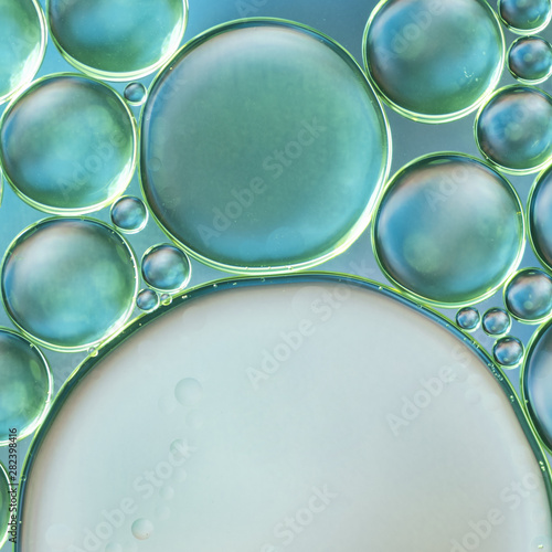 Sphere shaped air bubbles in water on blurred background photo