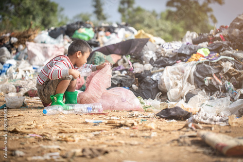 Children find junk for sale and recycle them in landfills, the lives and lifestyles of the poor, Poverty and Environment Concepts