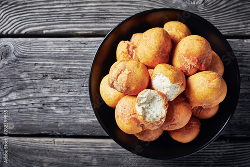 Caribbean Fried balls in a black bowl photo