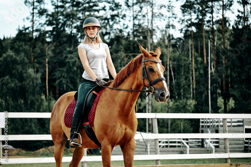 girl rider on horseback. horseback riding. © Olek