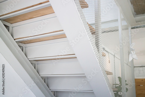 Wooden and white metal staircase