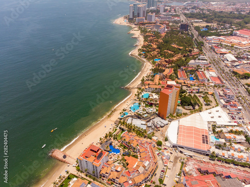 Fototapeta Naklejka Na Ścianę i Meble -  Aerial photos of the beautiful beach and hotels of Puerto Vallarta in Mexico, the town is on the Pacific coast in the state known as Jalisco