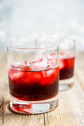 Old fashioned cherry cocktail with berries. Selective focus. Shallow depth of field. 