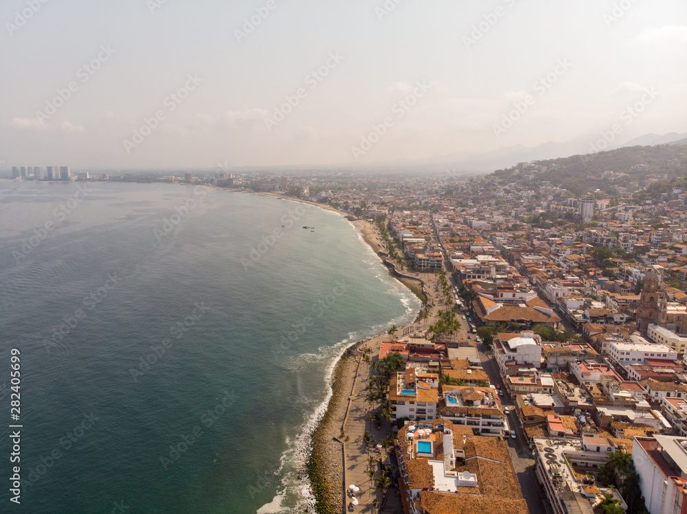 Naklejka premium Aerial photos of the beautiful beach and hotels of Puerto Vallarta in Mexico, the town is on the Pacific coast in the state known as Jalisco