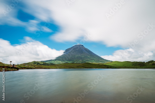 The famous Mount Pico, a volcano, on Pico Island, Azores, Portugal. against blue sky on a summer day