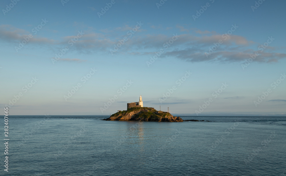 Mumbles Lighthouse island The iconic landmark that is Mumbles Lighthouse on the Gower peninsula in Swansea, South Wales, UK. Mumbles Lighthouse island The iconic landmark that is Mumbles Lighthouse on the Gower peninsula in Swansea, South Wales, UK.
