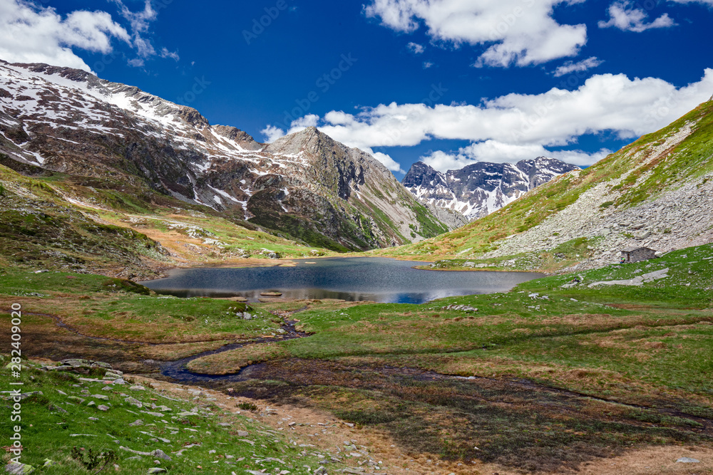 Panoramic view of the Pasitt Pass with its alpine lakes, in the Swiss Alps.