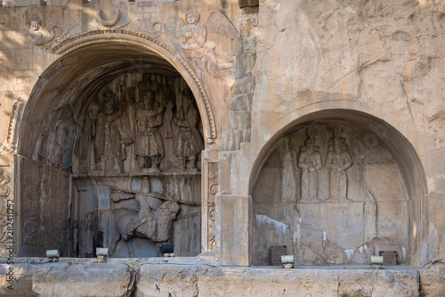 Iwans of Taq-e Bostan, a site with a series of large rock reliefs from the era of Sassanid Empire of Persia, carved around 4th century AD. photo