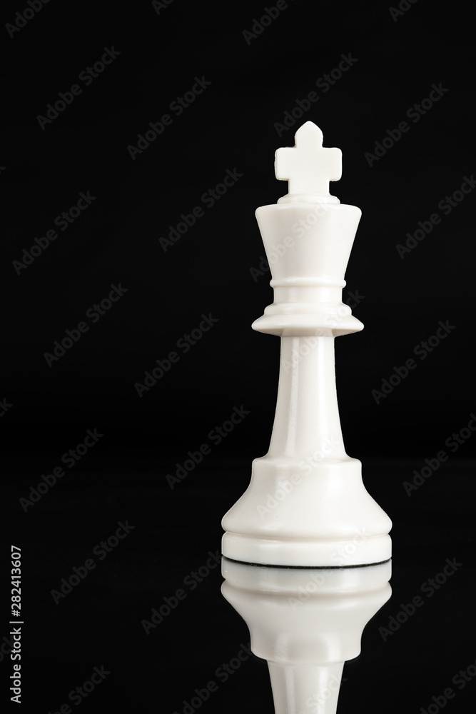 Chess piece close up on black background. Leadership concept Chess piece close up on black background. Leadership concept