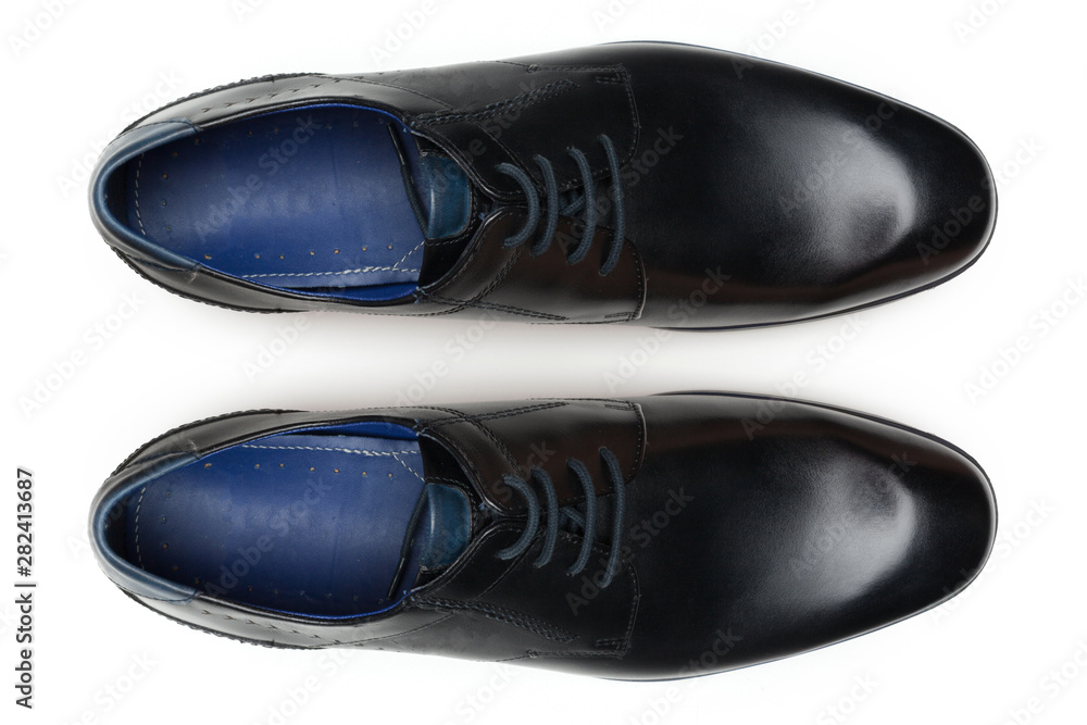 Classic male leather shoes isolated on a white, top view. Classic male leather shoes isolated on a white, top view.