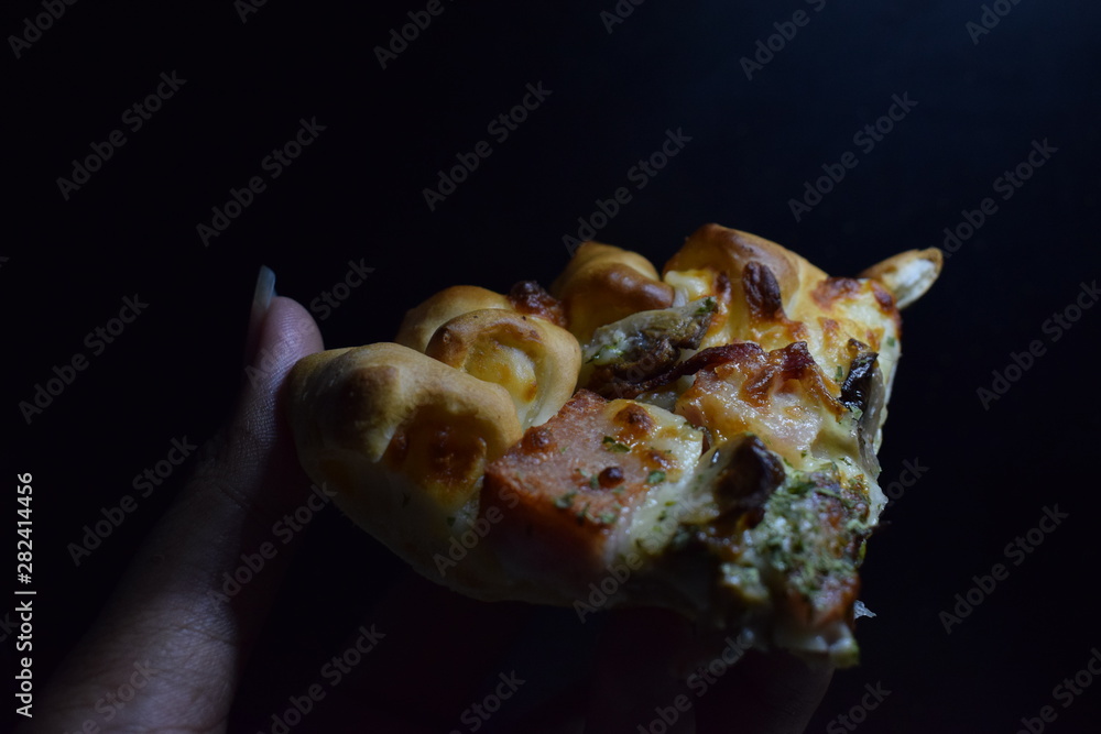 Hand Hold Cheese Meat Italian Pizza With Black Background