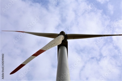 wind turbine against blue sky © Ulf