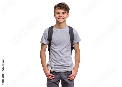 Student teen boy with backpack looking at camera Fototapeta