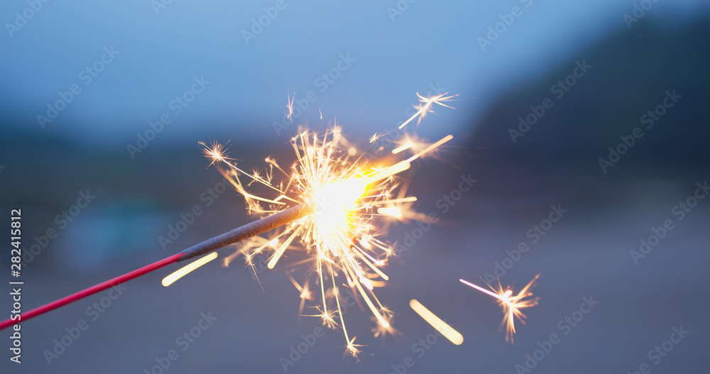 Play with sparklers in the summer time at outdoor