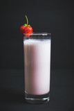 Strawberry milkshake with on the rustic background. Selective focus. 